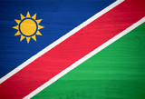 Namibia flag on wood texture