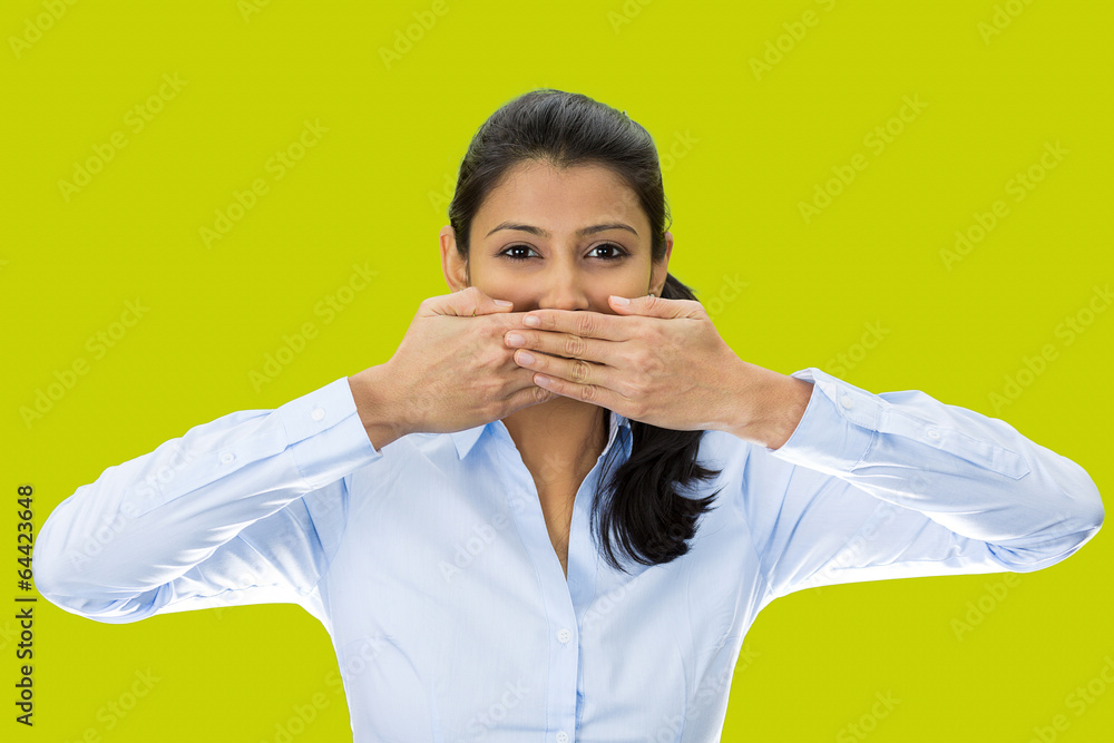 Speak no evil concept. Woman isolated on green background Speak no evil concept. Woman isolated on green background