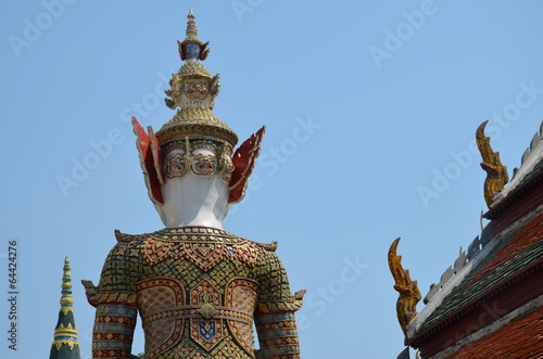 back of the statue and roof in grand palace in bangkok photo