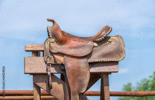 Leather horse saddle against blue sky