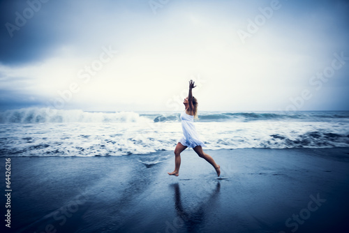 Casual Woman Celebrating Life by the Beach