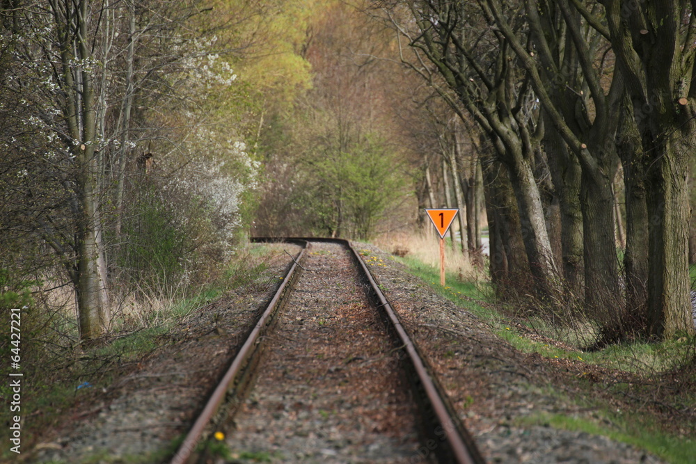 Rail track with orange number one sign, narrow field of view