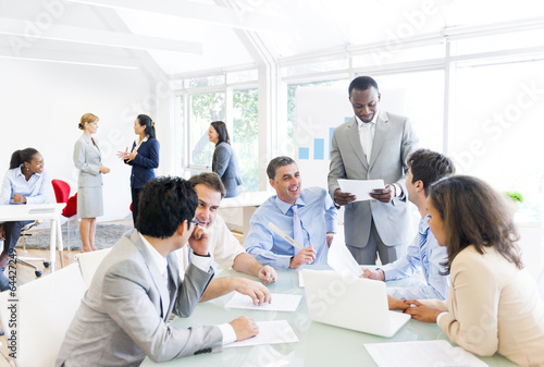 Group of Business People around Conference Table
