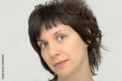 Portrait of a beautiful woman with magnificent green eyes photo