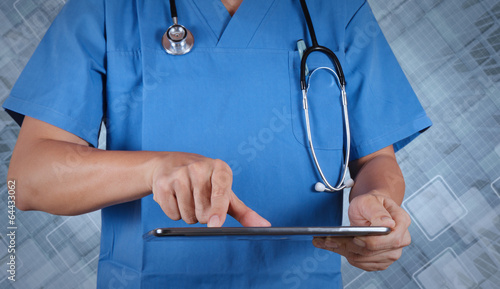 Doctor working on a digital tablet on texture background