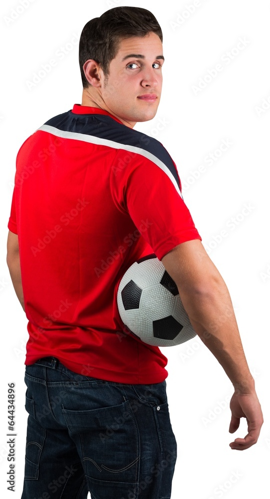 Football fan in red jersey holding ball