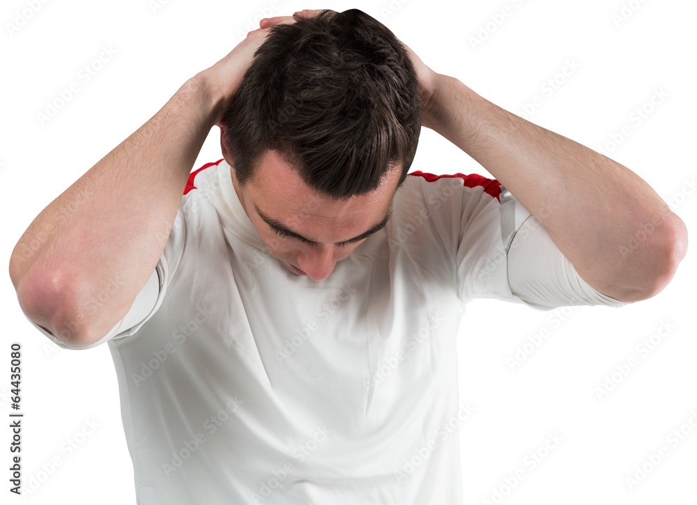 Disappointed football fan looking down Disappointed football fan looking down