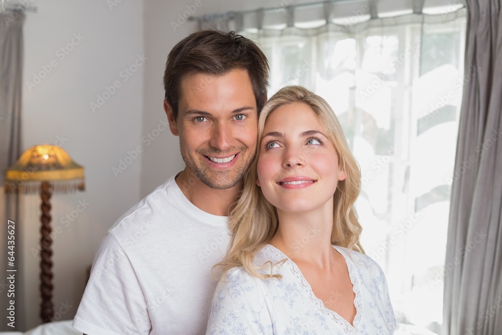 Smiling young couple together at home Smiling young couple together at home