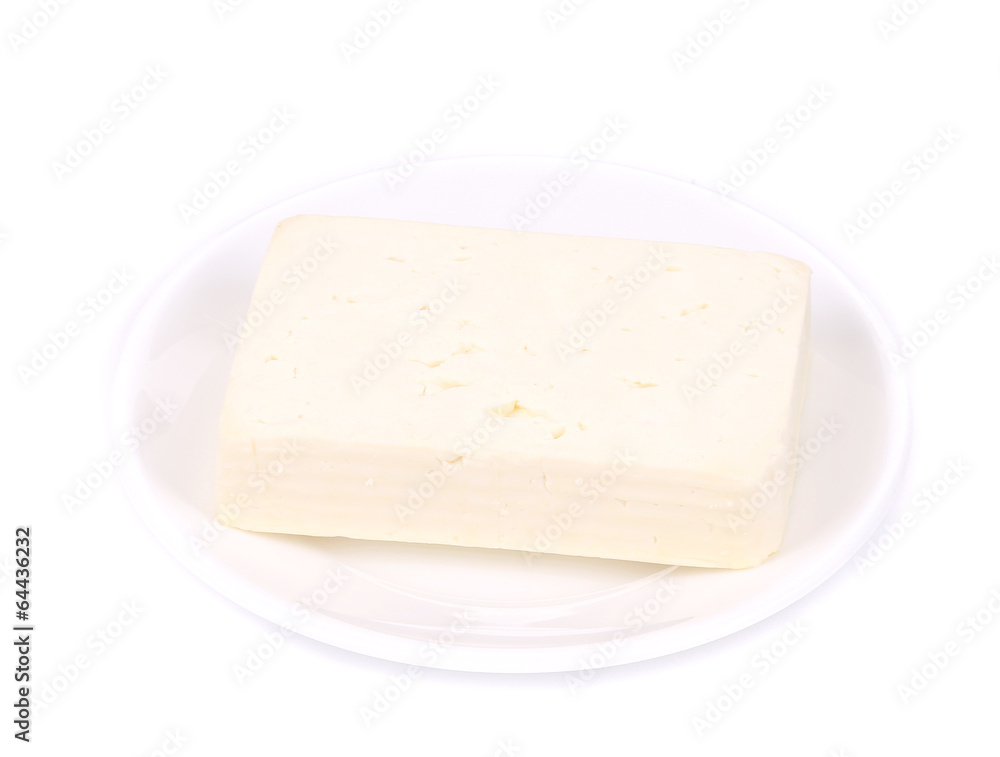 Tofu cheese on white plate.