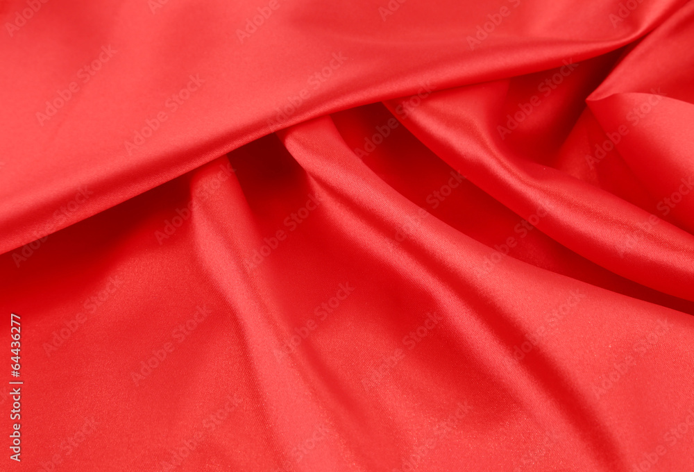 Close up of red silk fabric background. Close up of red silk fabric background.