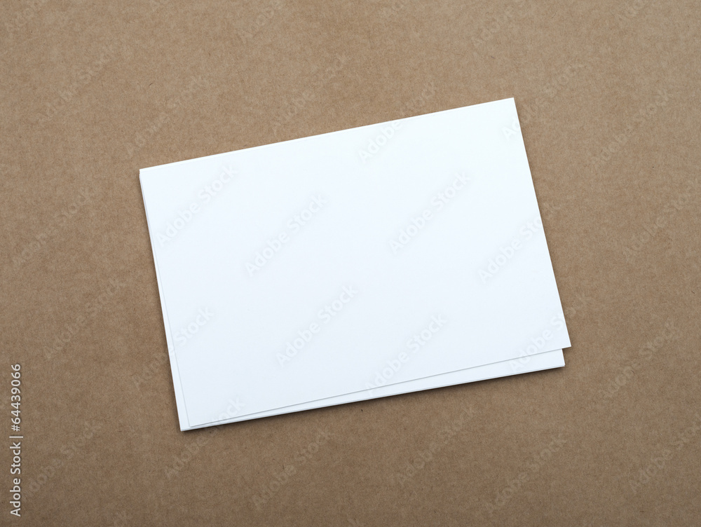 Stack of blank white business cards on crafts background Stack of blank white business cards on crafts background