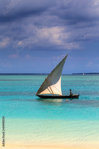 A traditional boat near a tropical beach