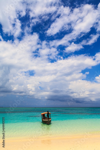 A traditional boat near a tropical beach