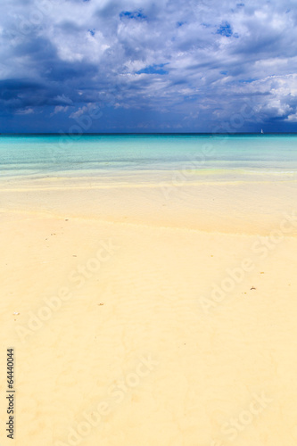 Dark storm clouds above a deserted beach © pwollinga
