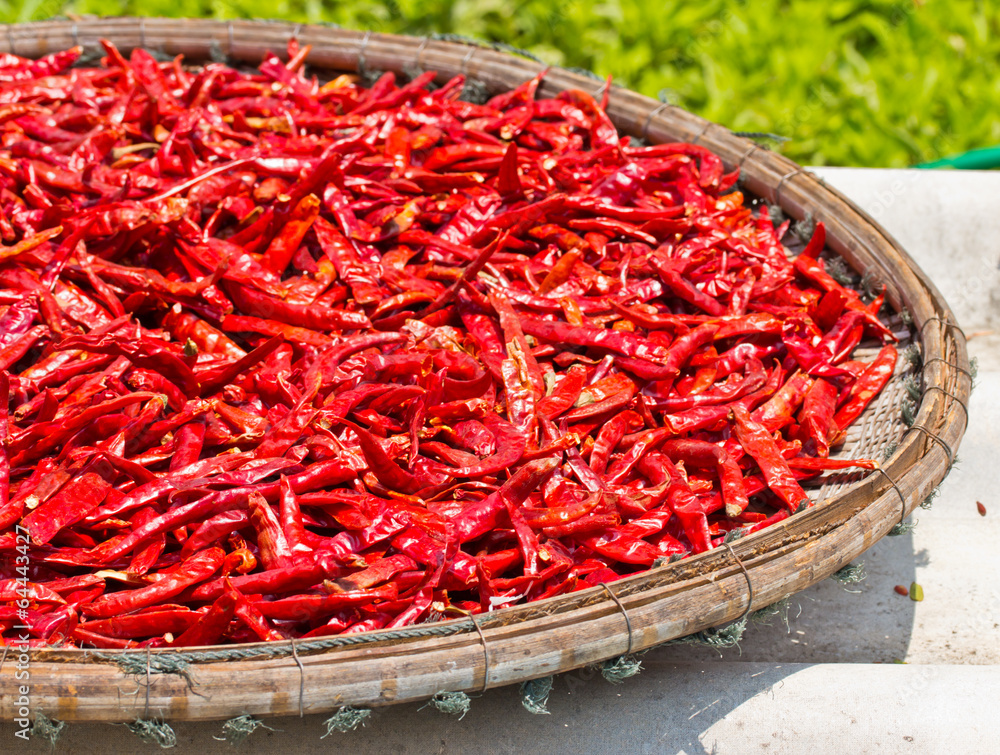 Dried red hot chili pepper in bamboo basket Dried red hot chili pepper in bamboo basket