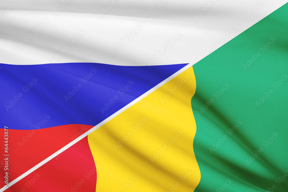 Fototapeta premium Series of ruffled flags. Russia and Republic of Guinea.