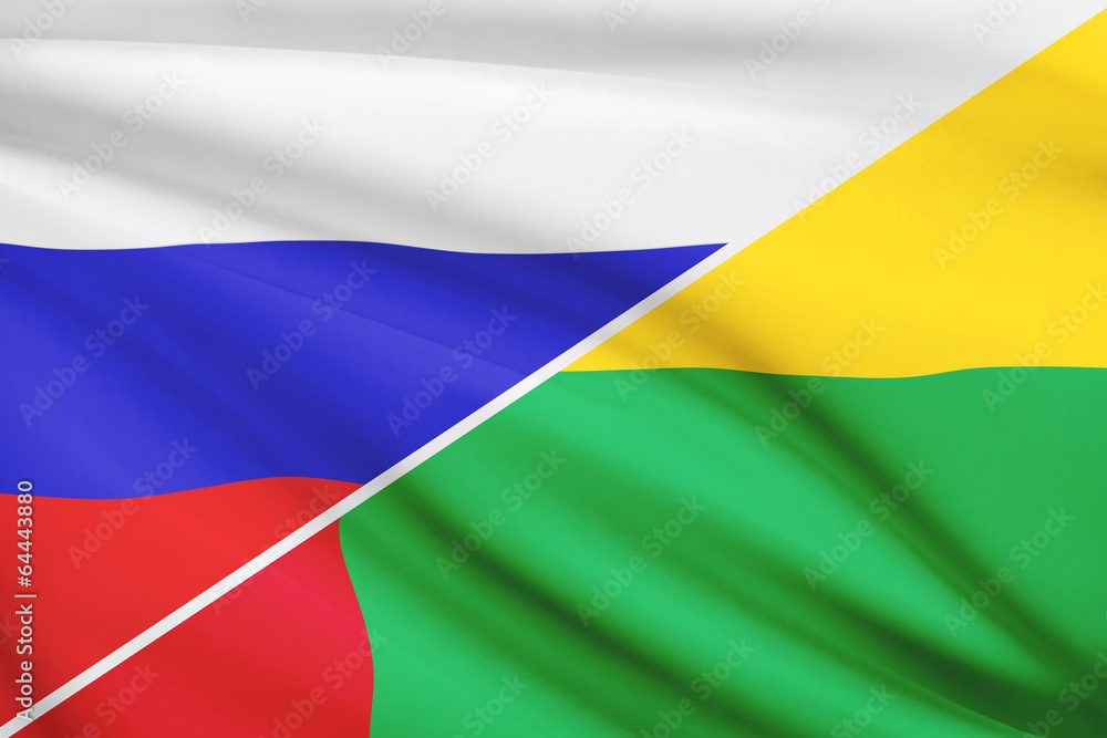 Obraz premium Series of ruffled flags. Russia and Republic of Guinea-Bissau.