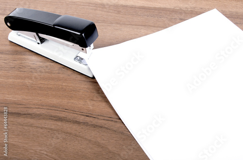 sheets of paper stapled by stapler