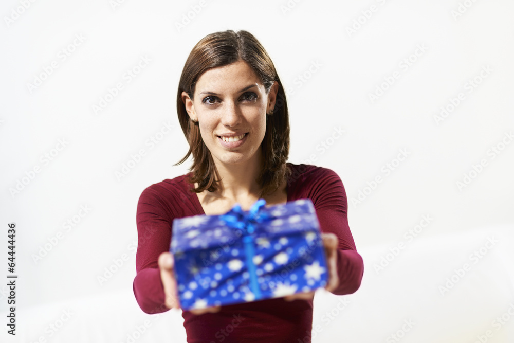 happy girl holding gift box to the camera happy girl holding gift box to the camera