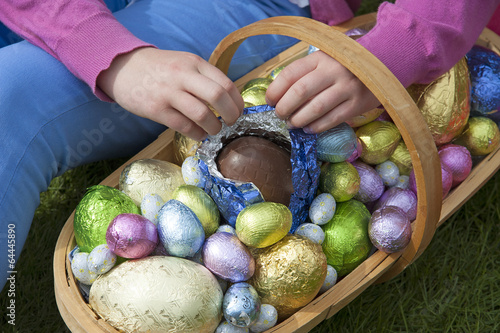 Easter eggs in a garden trug Opening chocolate egg photo