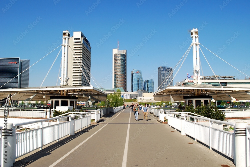 The Vilnius city walking bridge with skyscrapers
