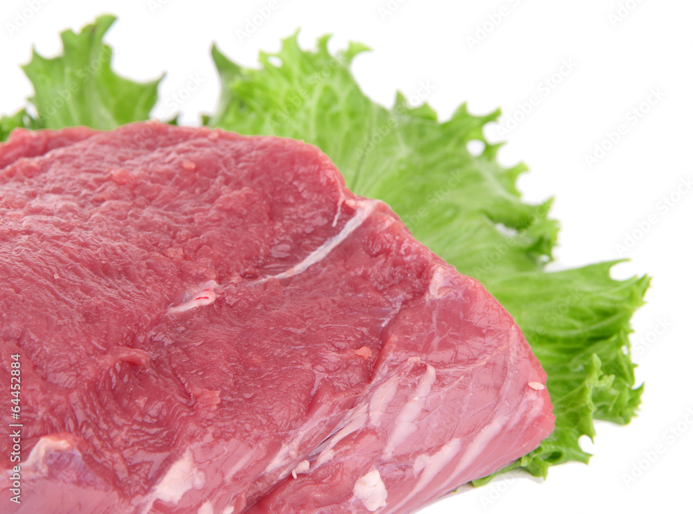 Raw beef meat with lettuce isolated on white Raw beef meat with lettuce isolated on white