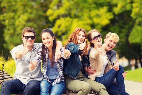 group of students or teenagers showing thumbs up