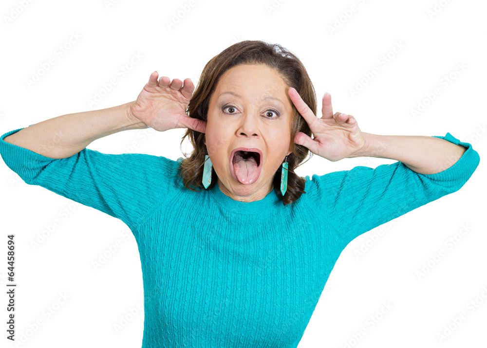 Immature senior elderly woman acting out sticking out tongue Immature senior elderly woman acting out sticking out tongue