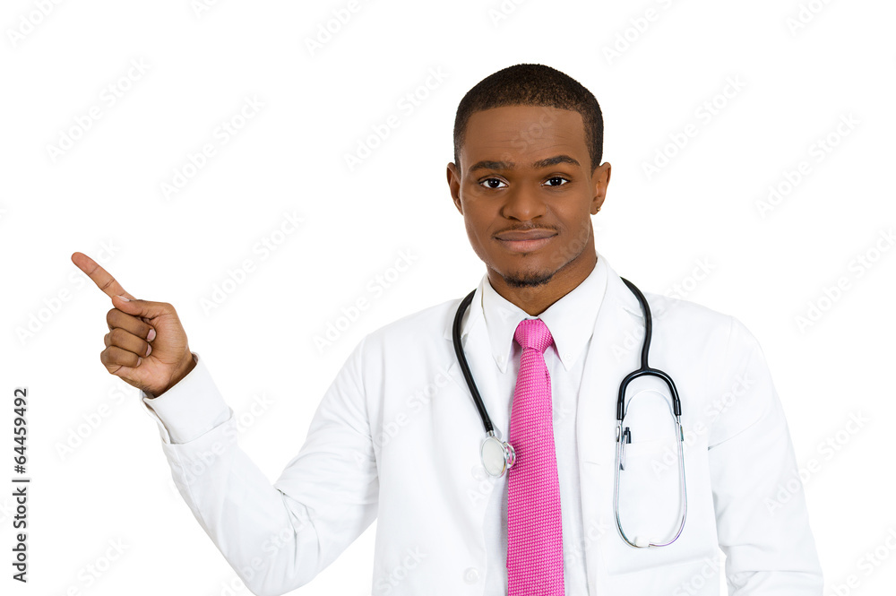Portrait advertising doctor pointing at blank copy space Portrait advertising doctor pointing at blank copy space