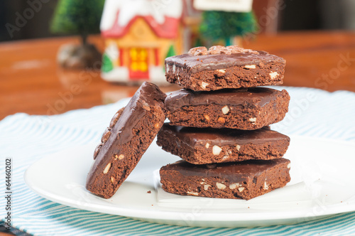 a pile of nutty milk chocolate coated brownies