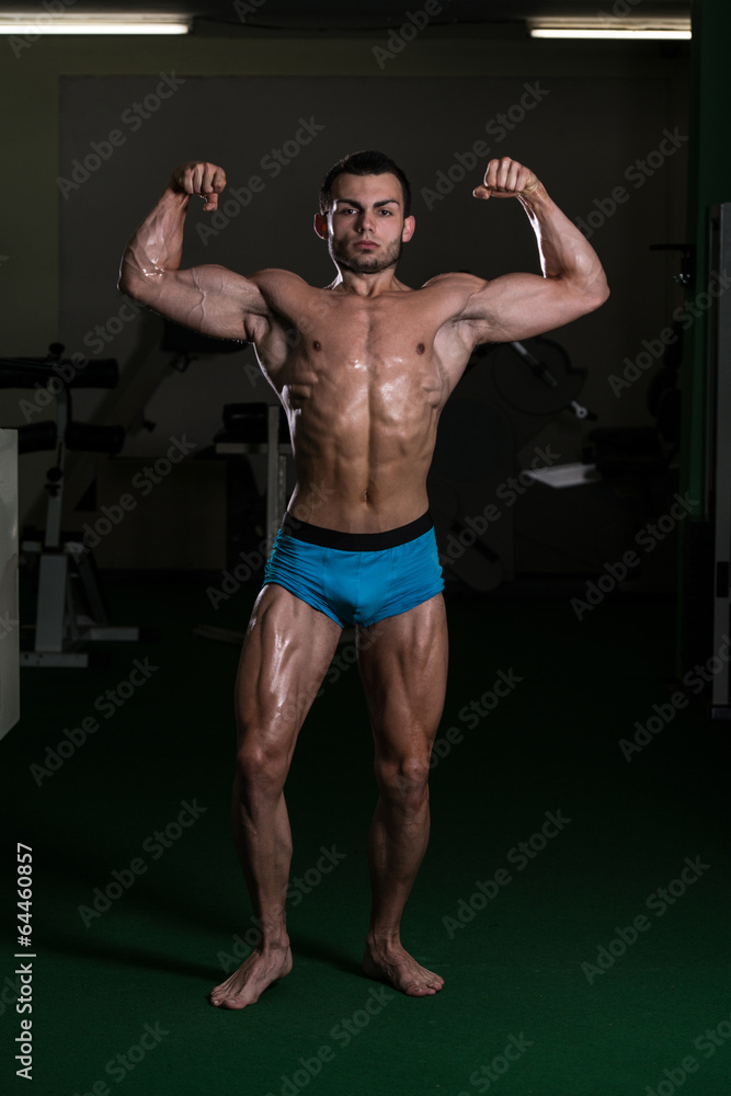 Bodybuilder Performing Front Double Biceps Poses Bodybuilder Performing Front Double Biceps Poses
