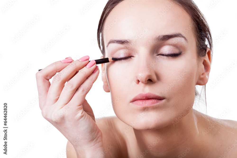 Woman using an eyeliner