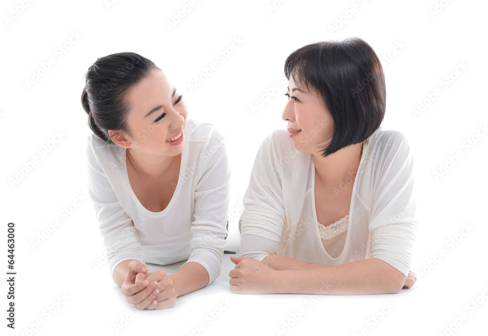 Mother and teenager daughter lying down Mother and teenager daughter lying down