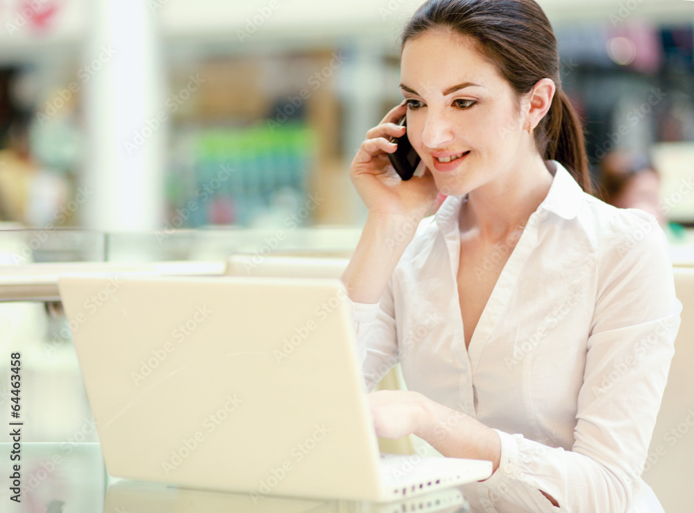 Portrait of a smiling businesswoman with phone. Portrait of a smiling businesswoman with phone.