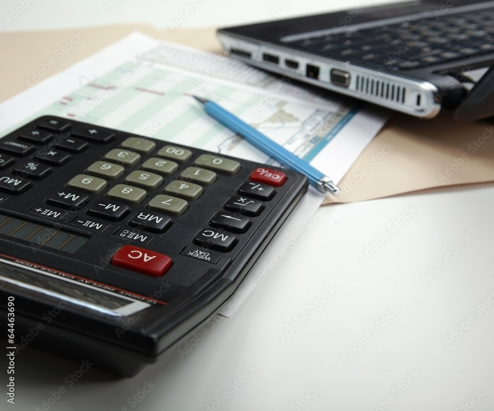 Calculator, pen, folder with documents, laptop Calculator, pen, folder with documents, laptop
