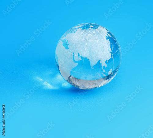 glass globe   isolated on blue background