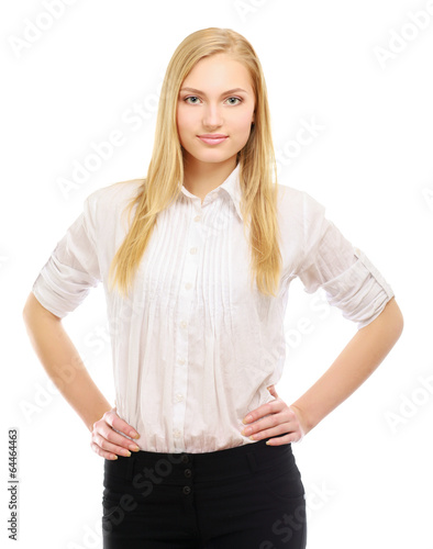 A portrait of a smiling young woman standing