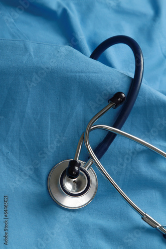 A stethoscope on a medical uniform, closeup.