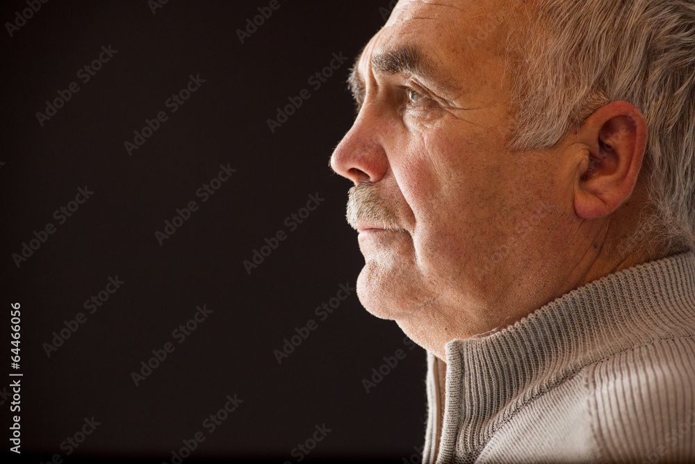 Fototapeta premium Beautiful portrait of a pensive senior man