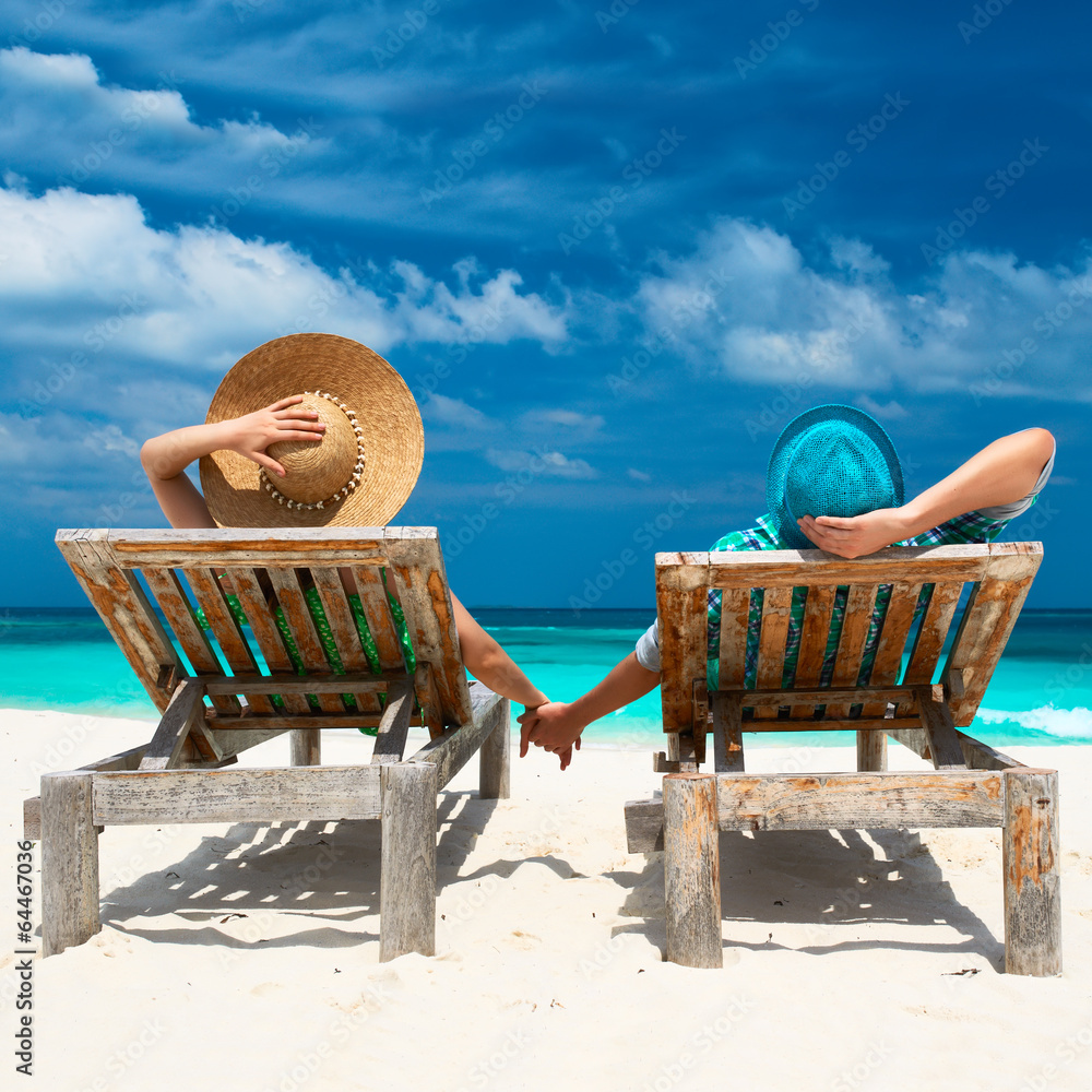Couple in green on a beach at Maldives