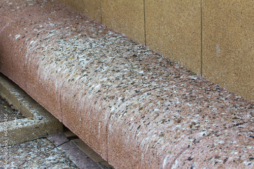 brown stone bench with bird shit in Thailand