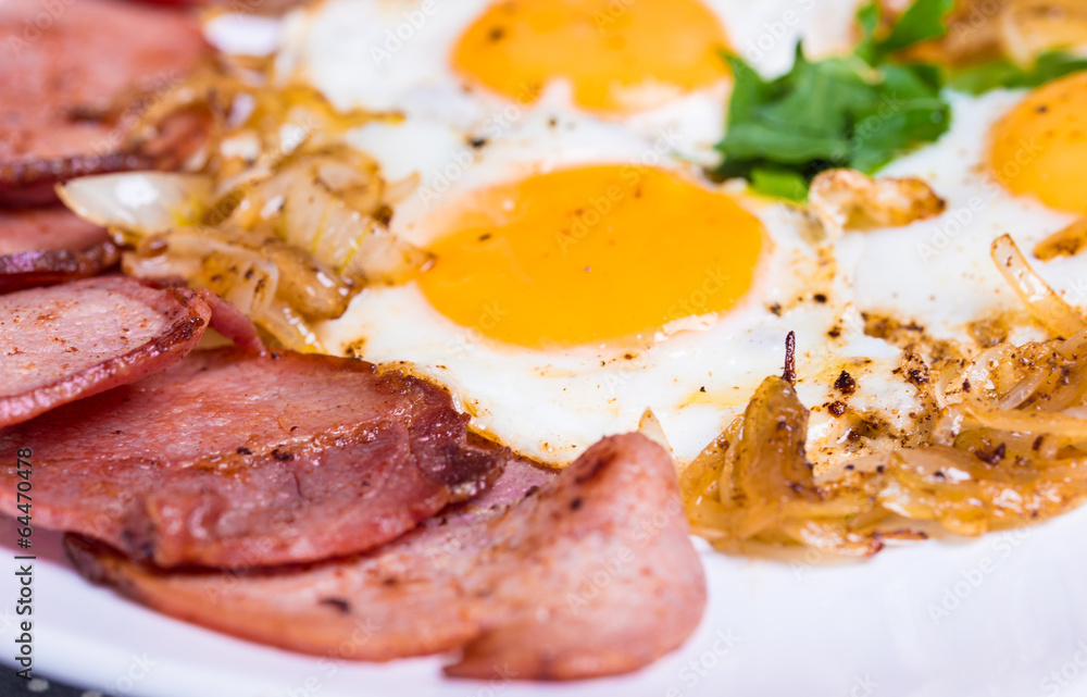 Breakfast with fried eggs beacon and onion Breakfast with fried eggs beacon and onion