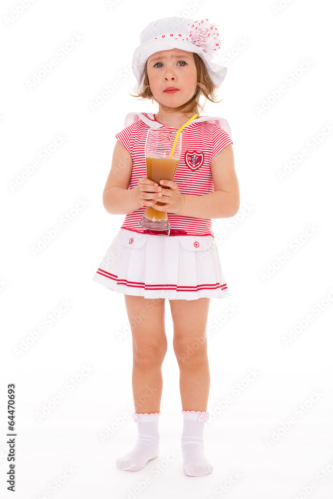 charming little girl with a glass of juice. charming little girl with a glass of juice.