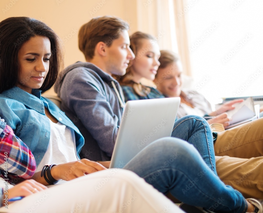 Group of multi ethnic young students preparing for exams Group of multi ethnic young students preparing for exams
