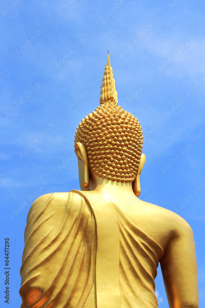 back  of  big  golden buddha statue in thai temple