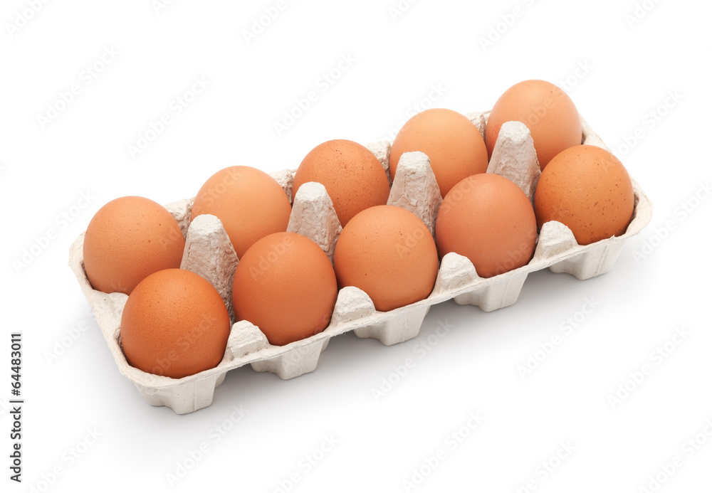 Brown eggs in egg box on white background
