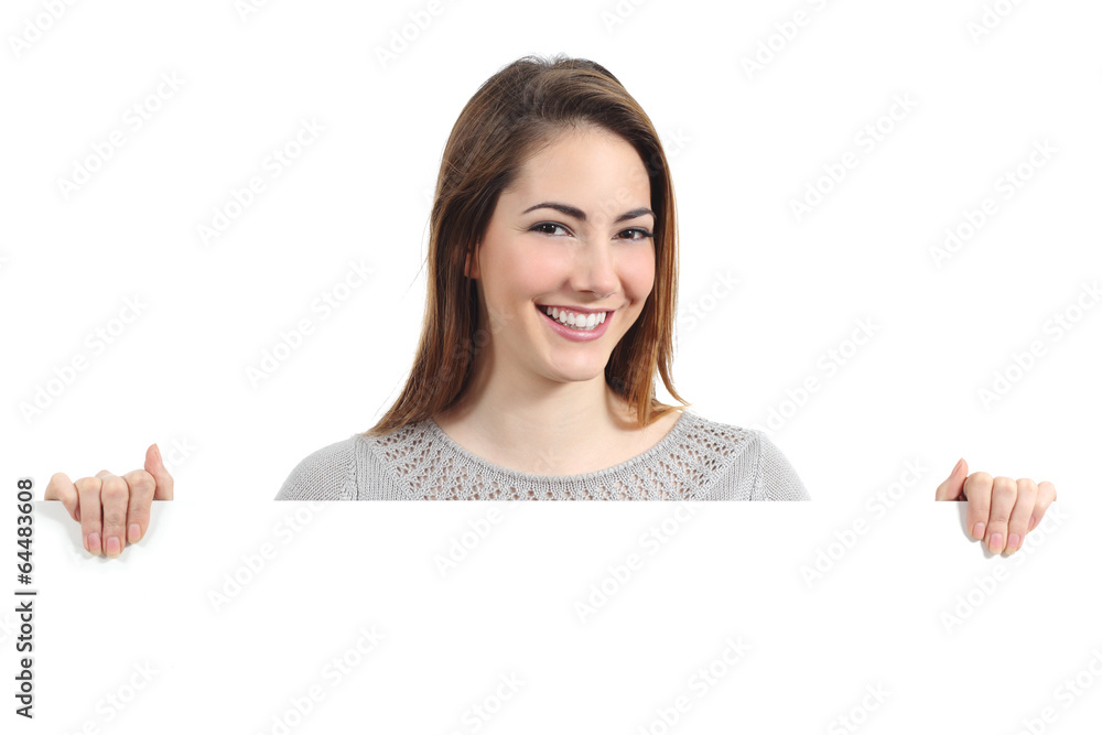 Beautiful happy woman smiling and holding a blank placard Beautiful happy woman smiling and holding a blank placard