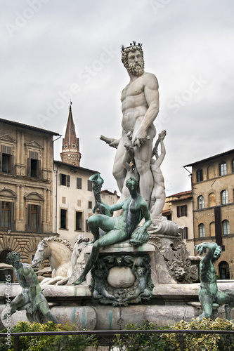 Statue on the Fountain of Neptune on the Piazza della Signoria i photo