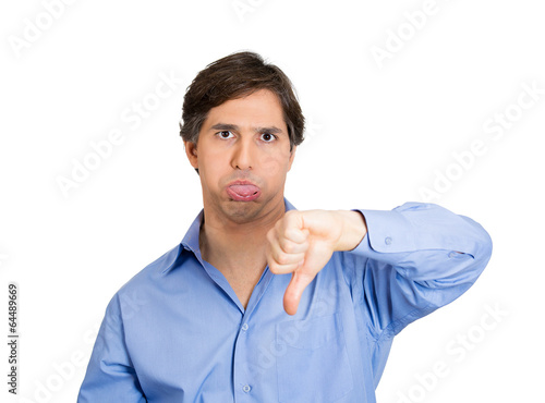 man showing thumbs down stick out his tongue disgusted 