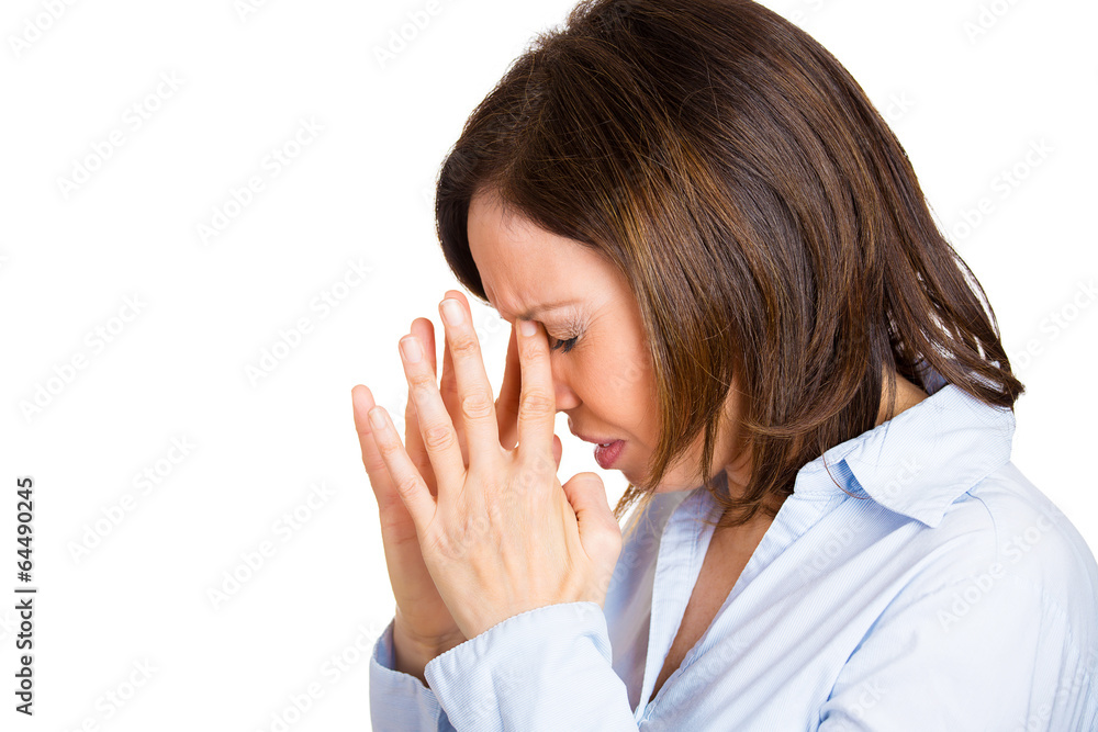 Upset stressed woman having headache, isolated white background Upset stressed woman having headache, isolated white background